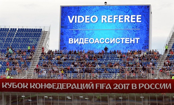 epa06037712 A video assistant referee (VAR) decision is announced on a huge screen during the FIFA Confederations Cup 2017 group B soccer match between Australia and Germany at the Fisht Stadium in So ...