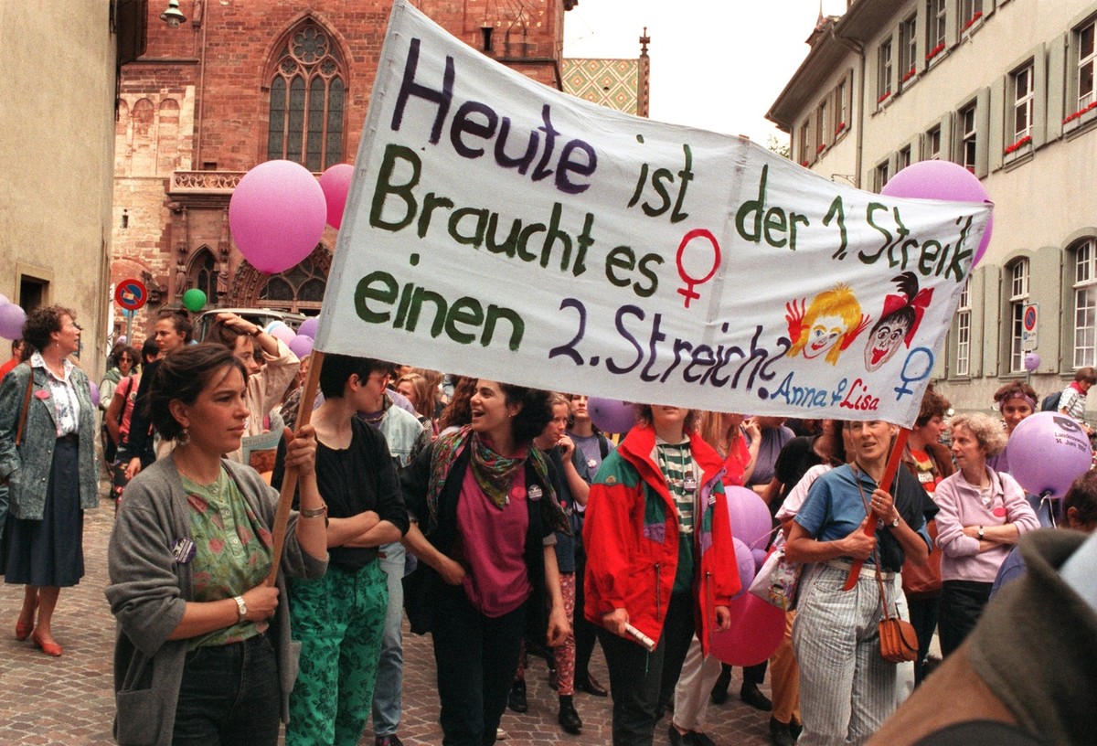 Women on strike in "Muenster" square in Basel, Switzerland, on the occasion of the national women's strike on June 14, 1991. Women are asking for the implementation of the constitution  ...