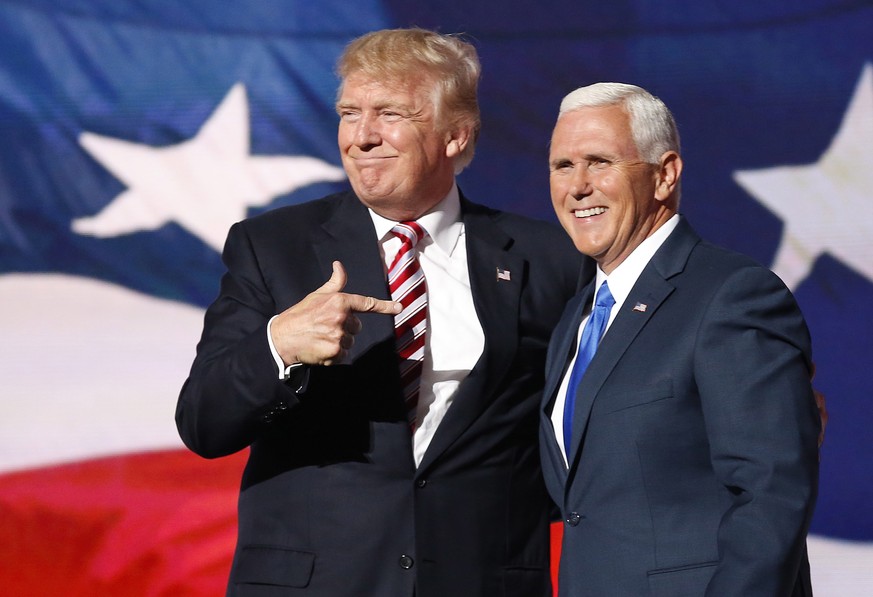 epa08939628 (FILE) Republican Presidential nominee Donald J. Trump (L) embraces Indiana Governor and Republican Vice Presidential nominee Mike Pence (R) during the third day of the 2016 Republican Nat ...