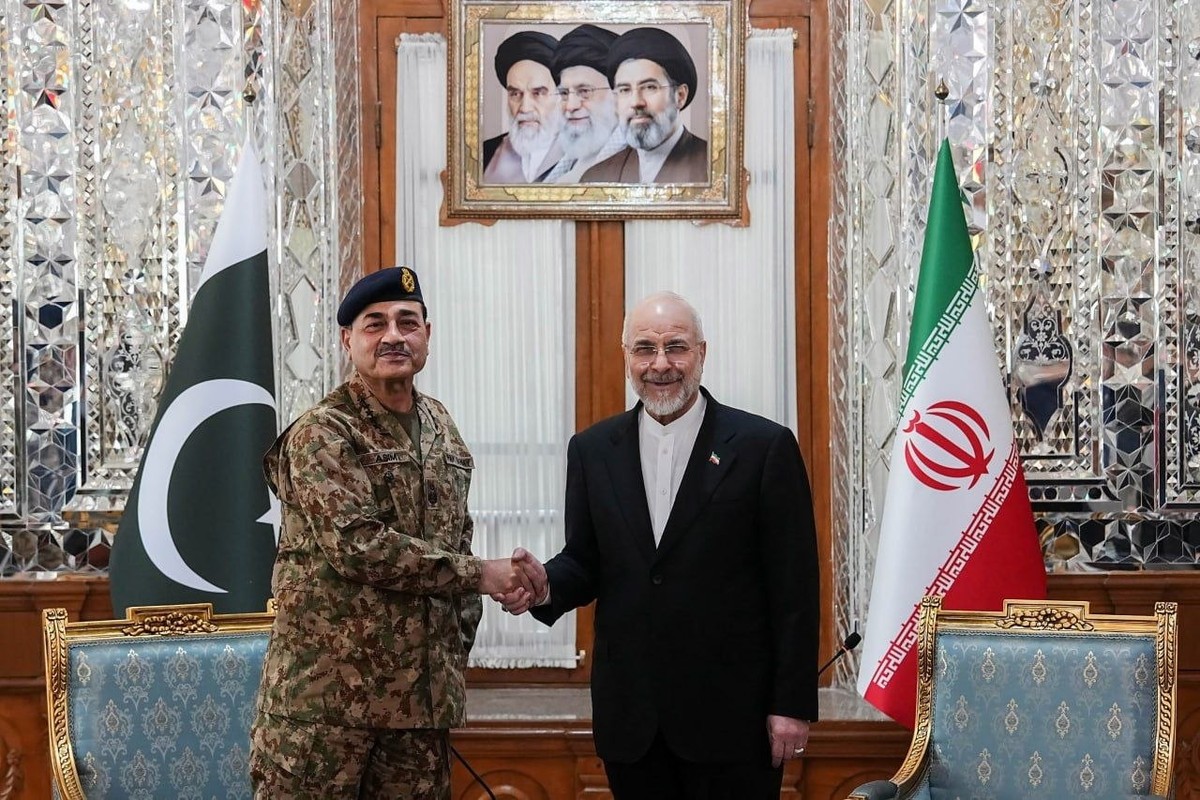 epa12893543 A handout picture made available by the Iranian Parliament Speaker's Office, shows Iranian Parliament Speaker Mohammad Bagher Ghalibaf (R) meeting with Pakistan army chief Asim Munir  ...