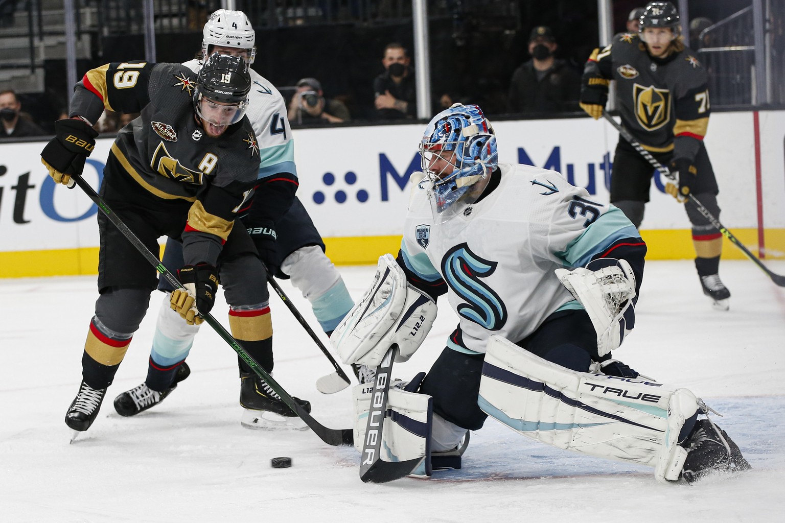 Seattle Kraken goaltender Philipp Grubauer (31) blocks the puck in front of Vegas Golden Knights right wing Reilly Smith (19) during the second period of an NHL hockey game Tuesday, Oct. 12, 2021, in  ...