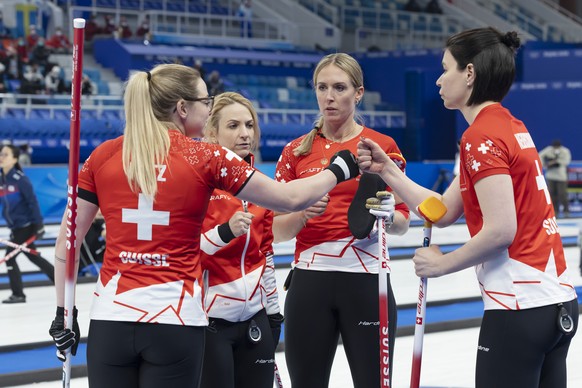 Switzerland skip Silvana Tirinzoni, 2nd left, with her teammates Alina Paetz, left, Melanie Barbezat, 2nd right, and Esther Neuenschwander, right, reacts during the women&#039;s Round Robin #6 game be ...