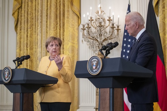 epa09347427 US President Joe Biden and German Chancellor Angela Merkel participate in a joint press conference in the East Room of the White House in Washington, DC, USA, 15 July 2021. The two leaders ...