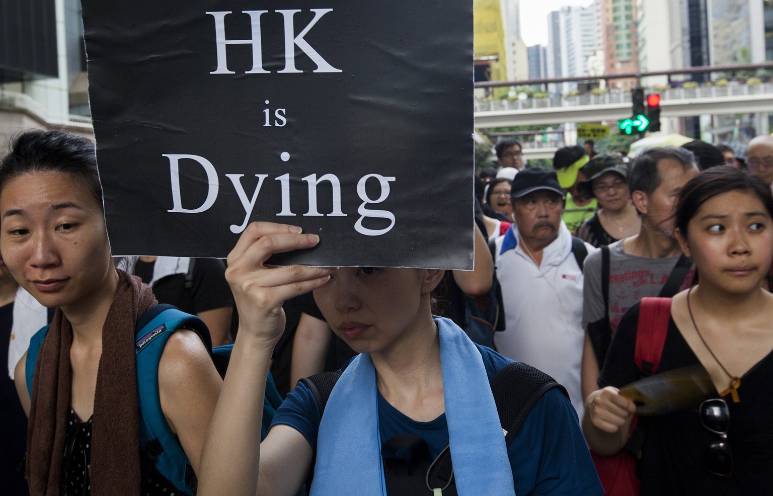 epa06059742 Pro-democracy protesters march through the streets of Hong Kong on the 20th anniversary of the handover of sovereignty from Britain to China on 01 July 1997, in Hong Kong, China, 01 July 2 ...