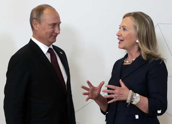 ADVANCE TO GO WITH RUSSIA US CLINTON FILE In this file photo taken on Saturday, Sept. 8, 2012, Russian President Vladimir Putin, left, meets U.S. Secretary of State Hillary Rodham Clinton on her arriv ...