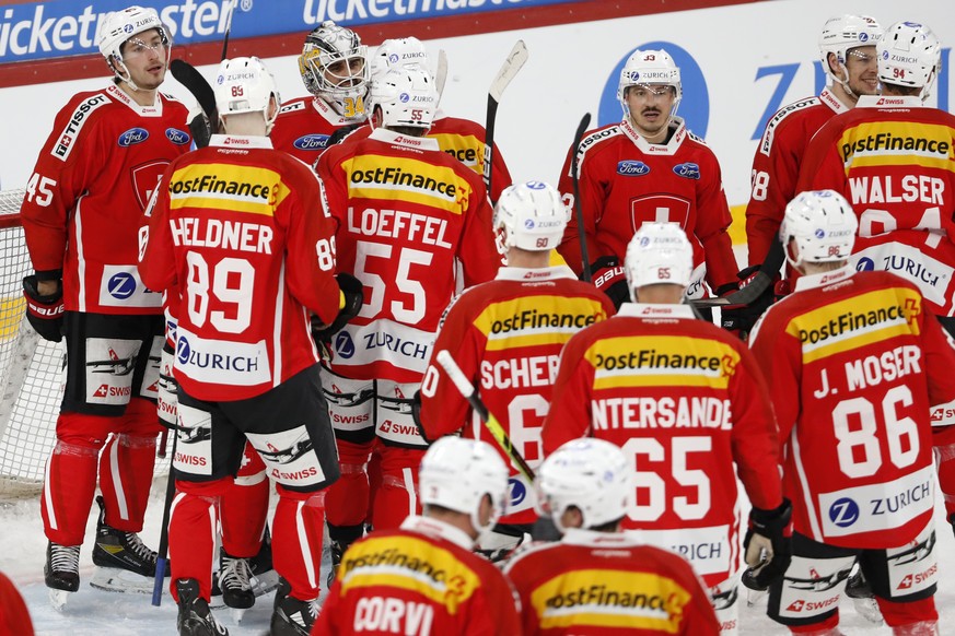 Switzerland&#039;s goalkeeper Niklas Schlegel, center back, celebrates with his teammates at the end of a friendly ice hockey match between Switzerland and Russia, at the Tissot Arena in Biel, Switzer ...