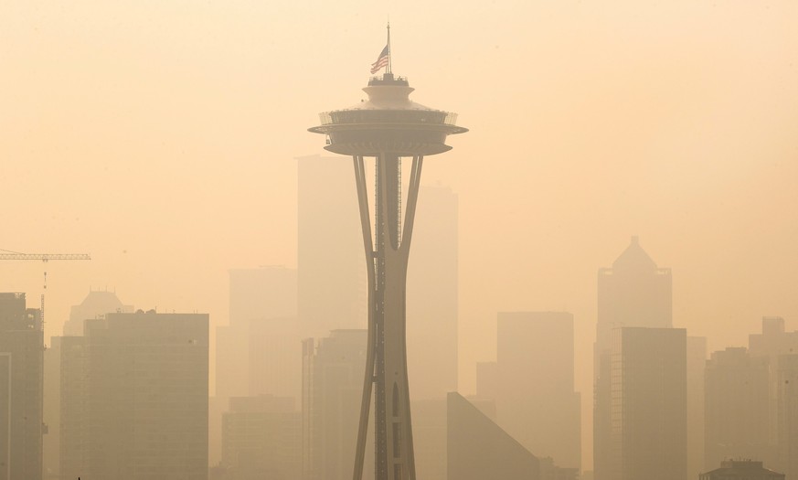 An American flag on top the Space Needle was lowered to half-staff today by the Seattle Fire Department to remember those who lost their lives on 9/11, Friday, Sept. 11, 2020. Thick smoke from wildfir ...