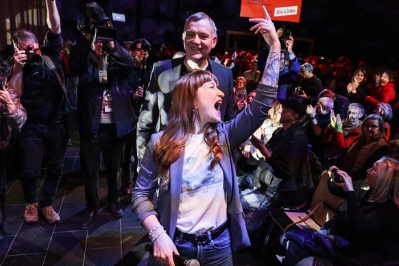 KEYPIX - epa11913335 Heidi Reichinnek (C front), top candidate of the Left Party (Die Linke), and Left Party co-leader Jan van Aken (C-back) react during the party's final election campaign event ...