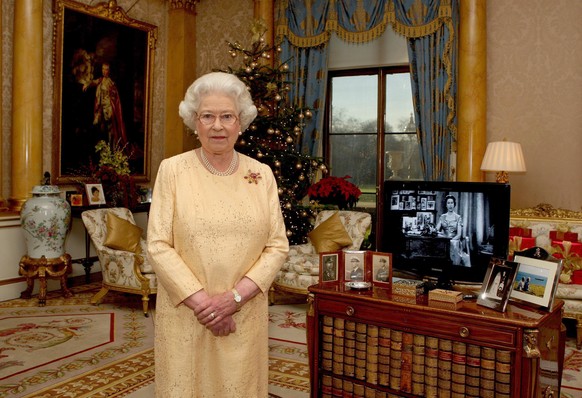 LONDON- DECEMBER 23: (NO PUBLICATION IN UK MEDIA FOR 28 DAYS) Queen Elizabeth ll delivers her Christmas speech in the 1844 Room at Buckingham Palace, marking the 50th anniversary of her first televise ...