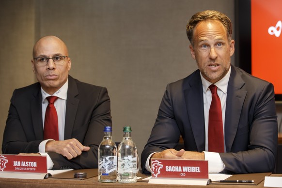 Sacha Weibel, right, CEO of the Lausanne Hockey Club, sitting next to Jan Alston, left, Sports Director of the Lausanne Hockey Club, speaks to the media, during a press conference of the Lausanne HC b ...