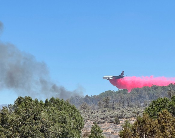 This photo provided by the Bureau of Land Management shows aerial resources working to suppress a wildfire burning north of Grand Canyon National Park in Ariz., on Thursday, July 10, 2025. (Bureau of  ...