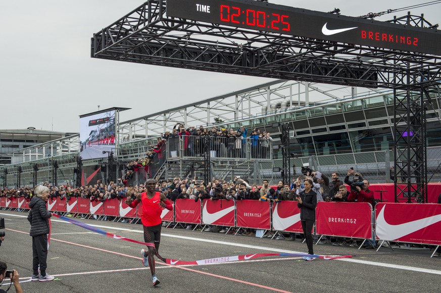 epa05946325 A handout photo made available by Nike, showing Eliud Kipchoge of Kenya clocking a time of 2:00.24 in a marathon event in Monza, north of Milan, Italy, 06 May 2017. Kipchoge was attempting ...