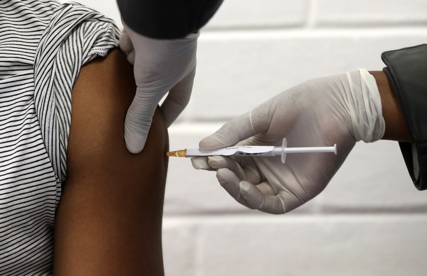epa08556527 (FILE) - One of the first South African vaccine trialists gets injected during the clinical trial for a potential vaccine against the Covid-19 Corona virus at the Baragwanath hospital in S ...