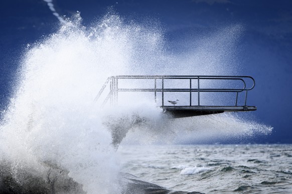 Waves hit a diving board during the Ciara storm on the shore of the Lake Geneva, in Lutry, Switzerland, Monday, February 10, 2020. Severe warnings have been issued for Western and Northern Europe as storm Ciara (also known as Sabine in Germany, and Switzerland and Elsa in Norway) is bringing strong winds and heavy rains causing disruption of land and air traffic. Winter storm Ciara reached Switzerland last night. (KEYSTONE/Laurent Gillieron)