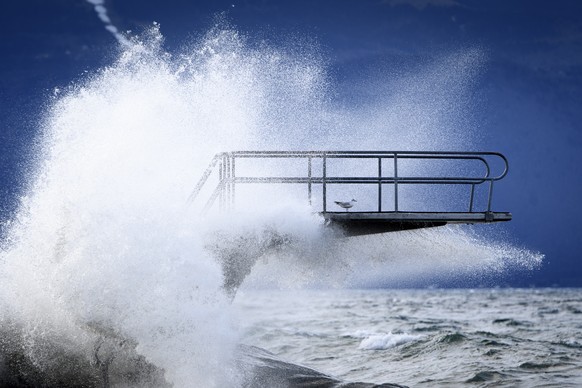 Waves hit a diving board during the Ciara storm on the shore of the Lake Geneva, in Lutry, Switzerland, Monday, February 10, 2020. Severe warnings have been issued for Western and Northern Europe as s ...