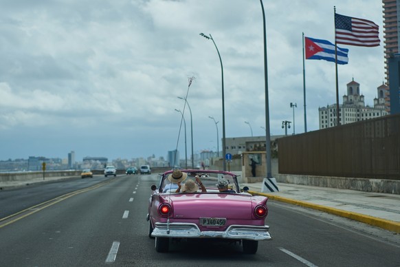 A classic American car carryies tourists past the U.S. Embassy in Havana, Monday, April 20, 2026. (AP Photo/Ramon Espinosa)
Cuba US