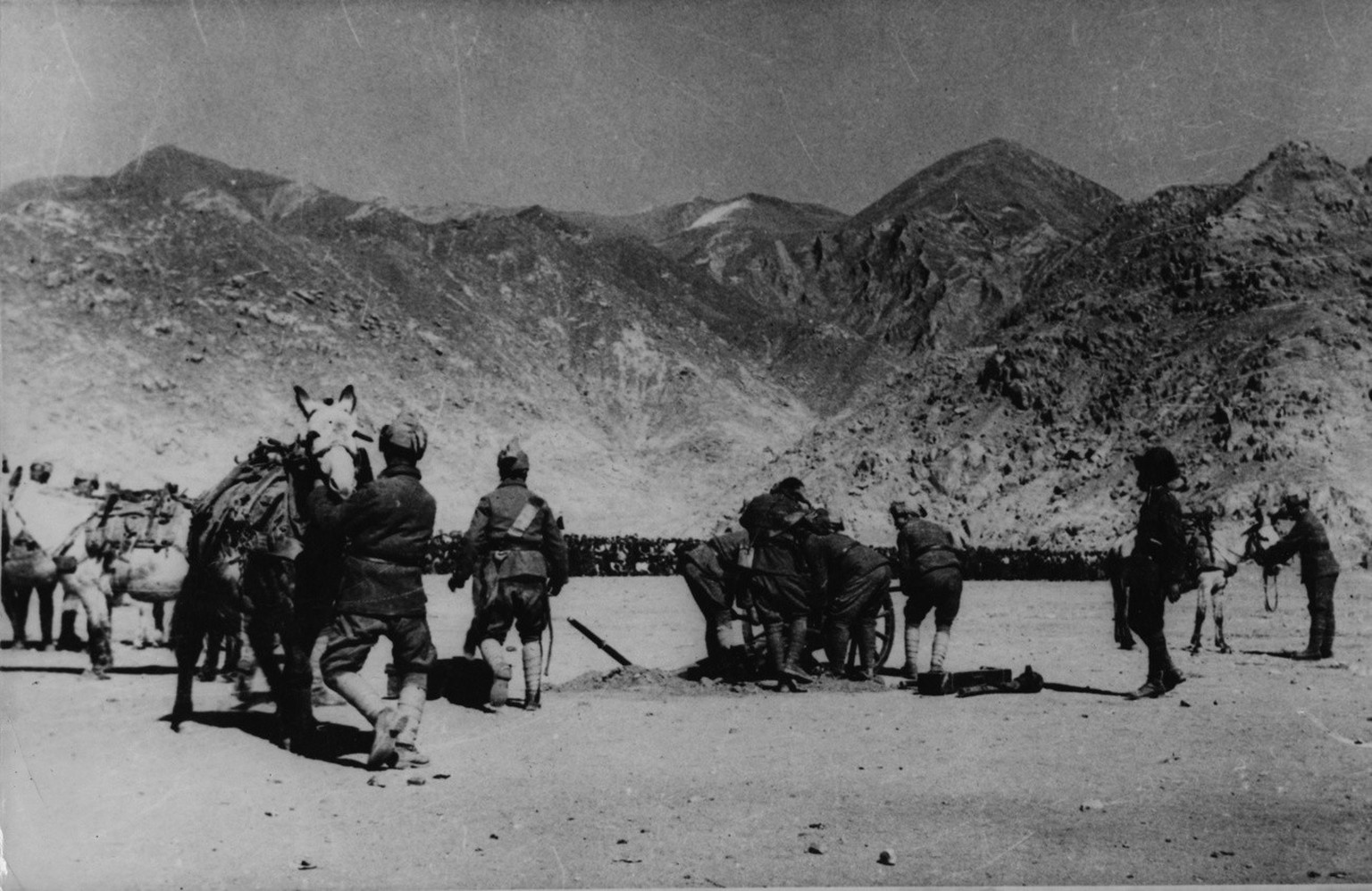 Troops of the Tibetan Dalai Lama&#039;s stage a field exercise as their mule-train artillery goes in action at the capital city of Lhasa, October 1950, as the news of the Chinese invasion of Tibet rea ...
