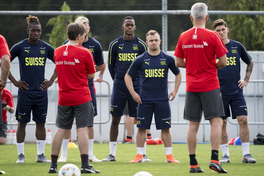 Switzerland&#039;s players Jacques Francois Moubandje, Edimilson Fernandes, Xherdan Shaqiri, and Steven Zuber from left to right react during a training session at the PortoGaia training center, in Cr ...