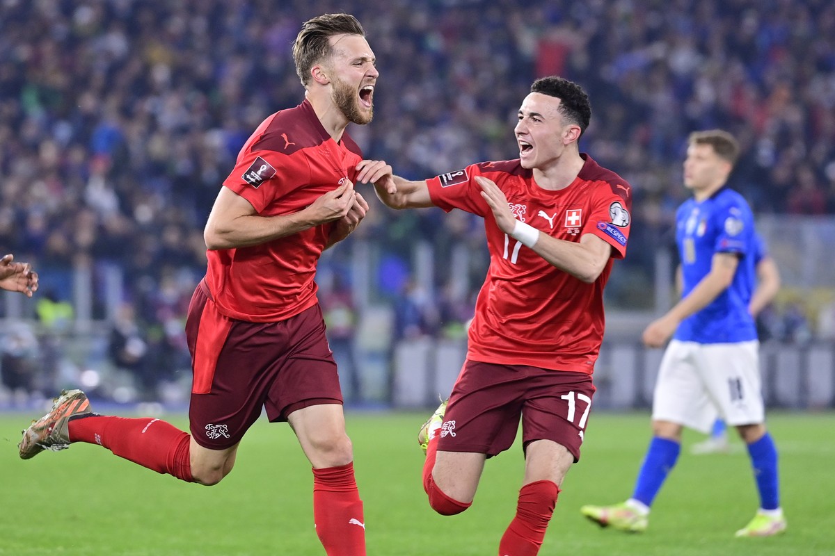 Switzerland's defender Silvan Widmer, left, celebrates his first goal with Switzerland's midfielder Ruben Vargas, right, during the 2022 FIFA World Cup European Qualifying Group C match betw ...