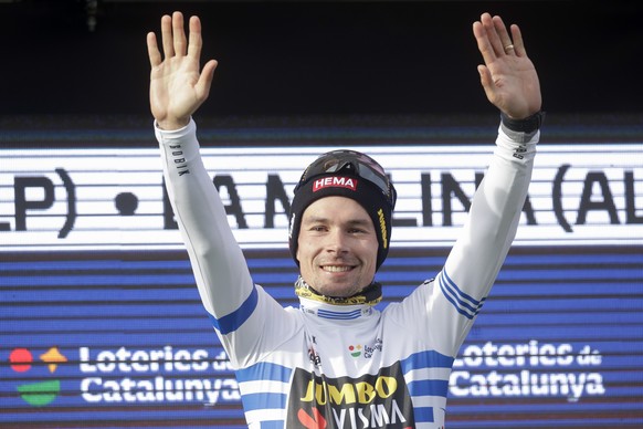 epa10537239 Overall leader Slovenian rider Primoz Roglic of Jumbo-Visma team celebrates on the podium after the third stage of the 102nd Volta a Catalunya cycling race, over 180.6km from Olost to La M ...