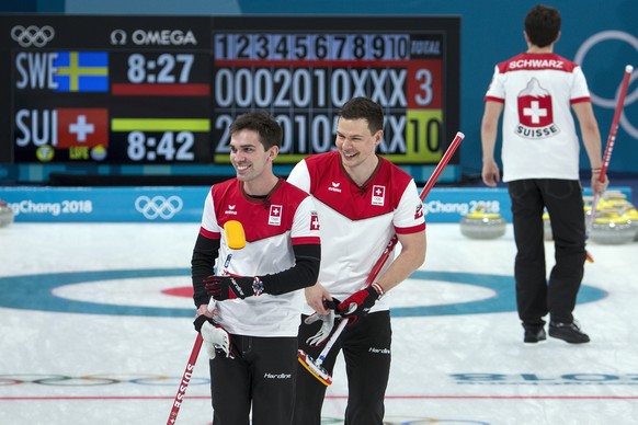 Peter de Cruz, Claudio Paetz and Benoit Schwarz of Switzerland, from left, during the men Curling round robin game between Switzerland and Sweden in the Gangneung Curling Center in Gangneung at the XX ...