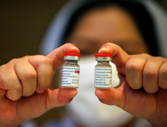 epa09069148 A Thai nurse displays vials of vaccine against COVID-19 developed by AstraZeneca after the cancelation and postponement of the vaccination event for the Prime Minister and cabinet minister ...