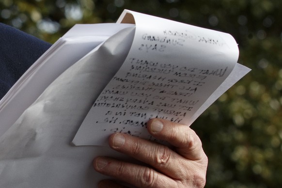President Donald Trump holds handwritten notes as he speaks to the media about the House Intelligence Committee testimony of U.S. Ambassador to the European Union Gordon Sondland, Wednesday, Nov. 20, ...