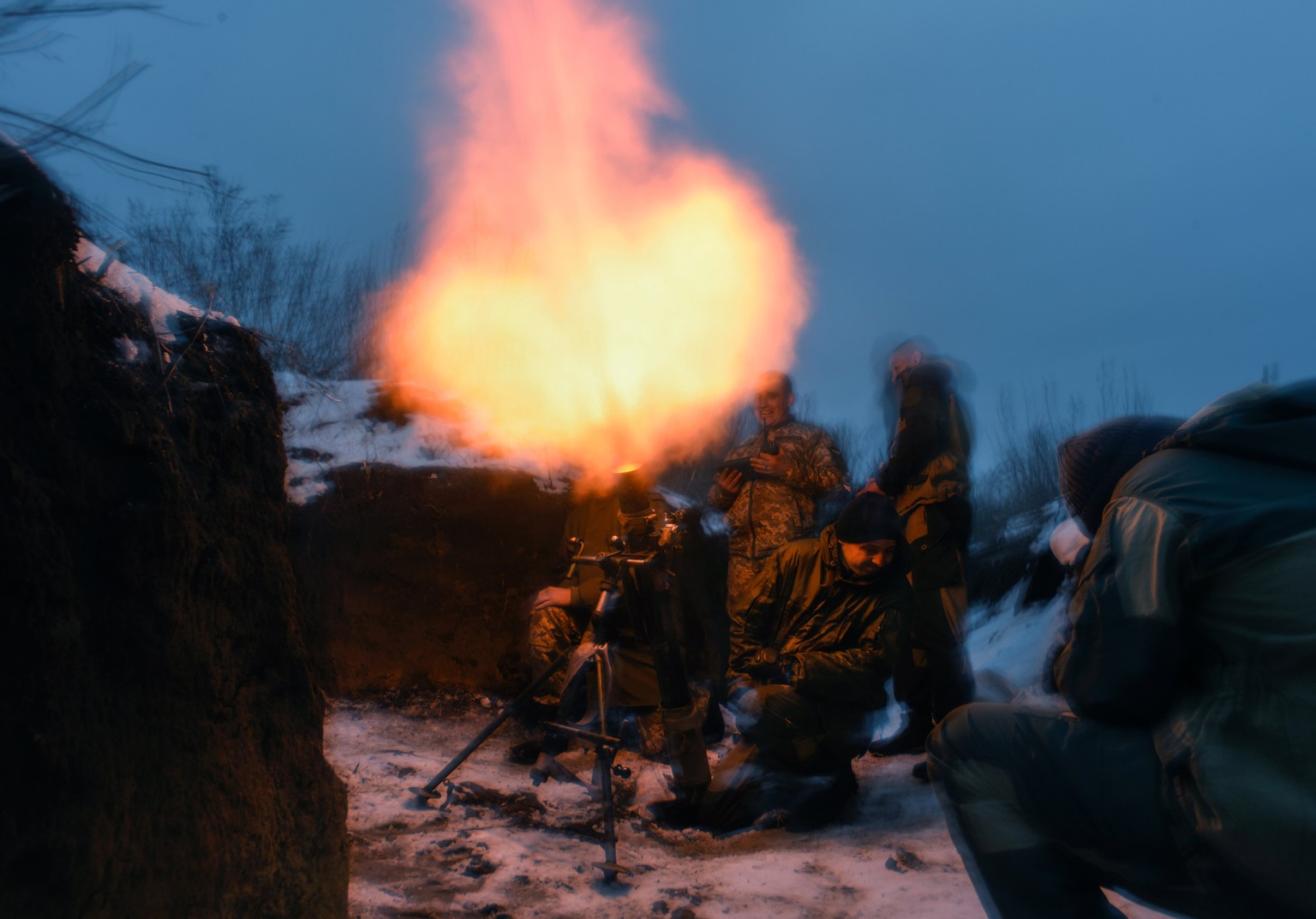 epa06547605 Picture made available on 20 February 2018 shows Ukrainian servicemen shoot a mortar from their position at the so-called Svitlodarska Duha, a stretch between the pro-Russian militant-cont ...