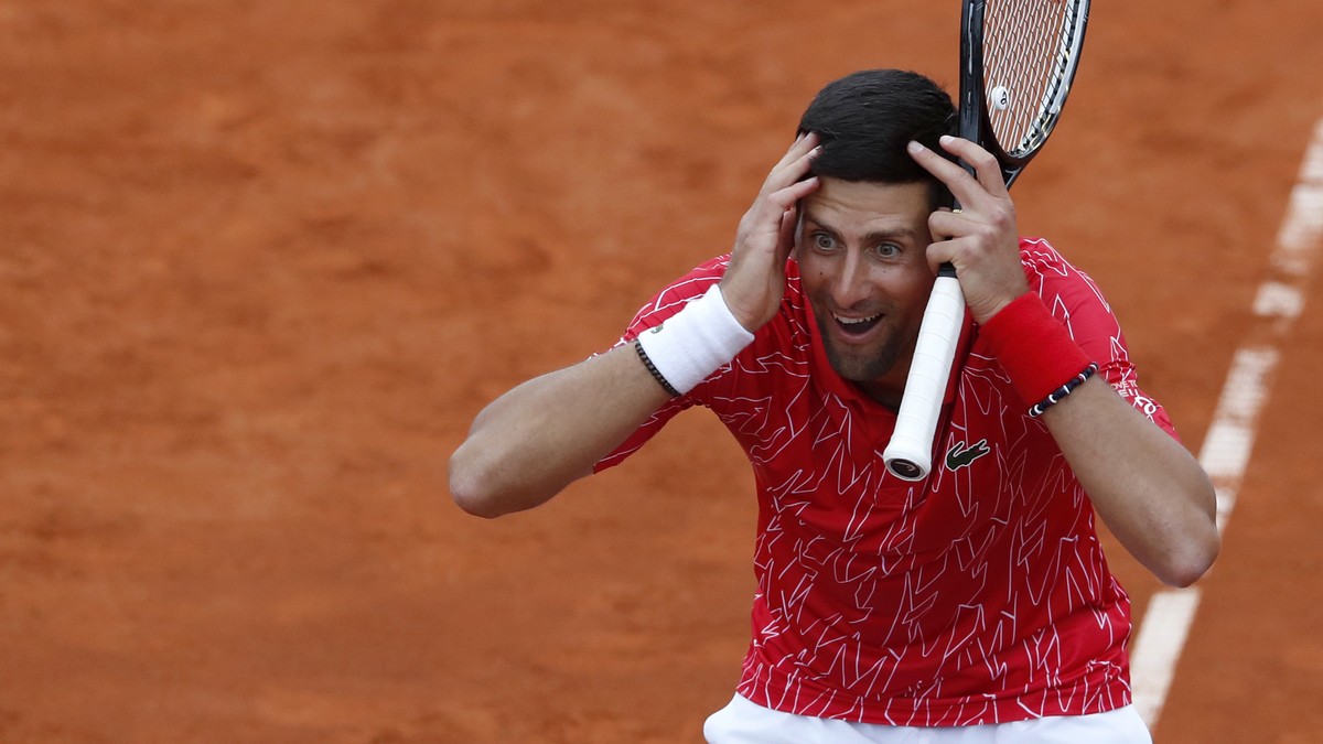Serbia's Novak Djokovic reacts during a tennis doubles match with Jelena Jankovic against Serbia's Nenad Zimonjic and Olga Danilovic at charity tournament Adria Tour, in Belgrade, Serbia, Fr ...