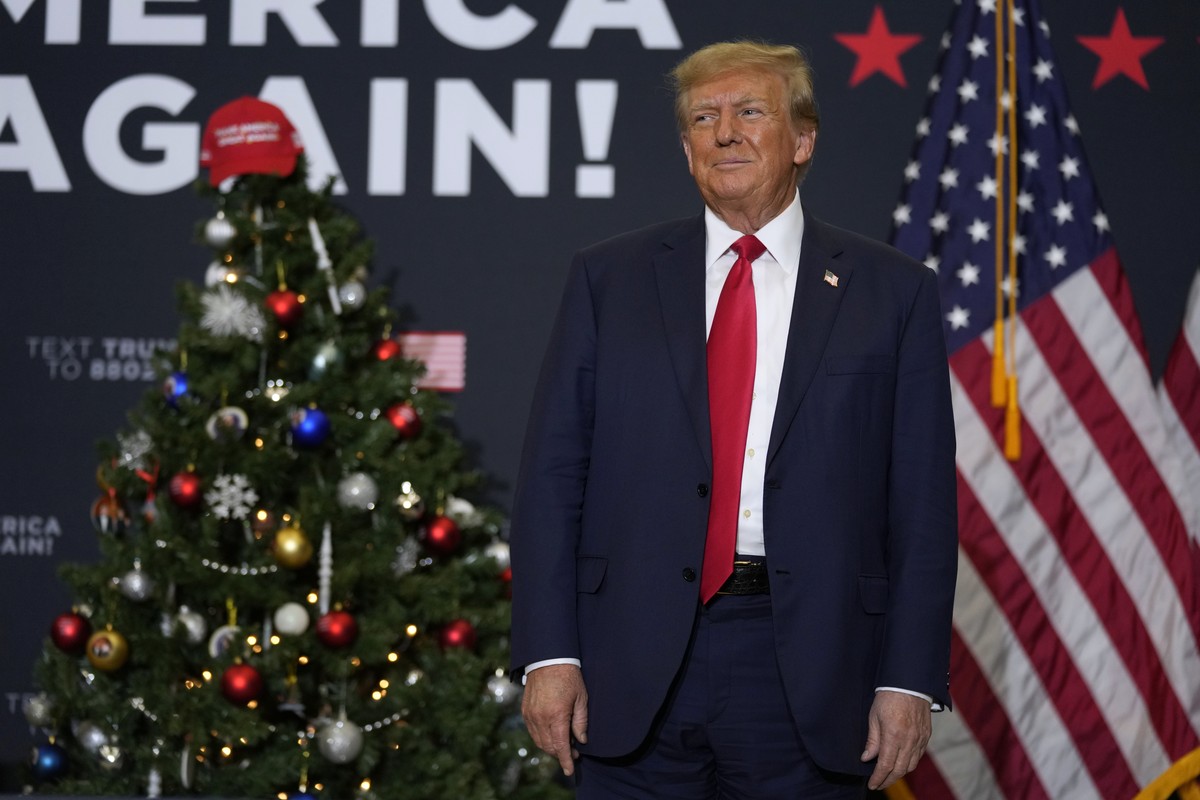 Former President Donald Trump arrives at a commit to caucus rally, Tuesday, Dec. 19, 2023, in Waterloo, Iowa. (AP Photo/Charlie Neibergall)