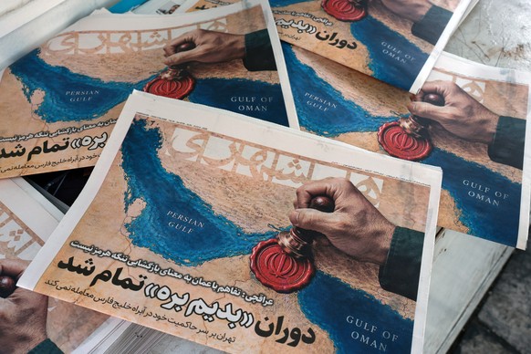 KEYPIX - epa13157694 Copies of the Iranian daily newspaper Hamshahri, which features a picture of the Strait of Hormuz and a headline quoting Iranian Foreign Minister Abbas Araghchi: 'The Oman de ...