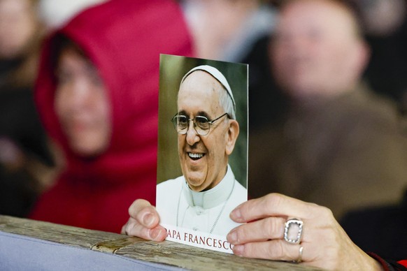 epa11974630 Faithful attend a Rosary prayer for the health of Pope Francis, who is hospitalized with pneumonia, at St. Peter&#039;s Square in Vatican City, 19 March 2025. Pope Francis was admitted to  ...