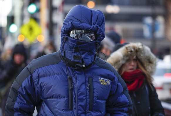epa07334135 A man braves the freezing weather as he walks in Chicago, Illinois USA, 31 January 2019 Media reports state that more than 200 million people are facing freezing temperatures as Polar vort ...