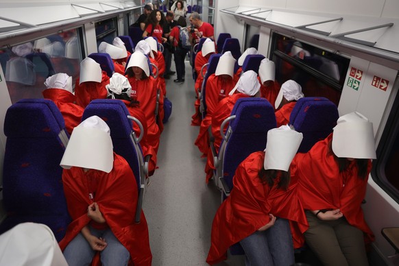 epa10496485 Women wearing costumes from the TV series &#039;The Handmaid&#039;s Tale&#039; ride a train during an anti-government protest in Jerusalem, Israel, 01 March 2023. People have been protesti ...