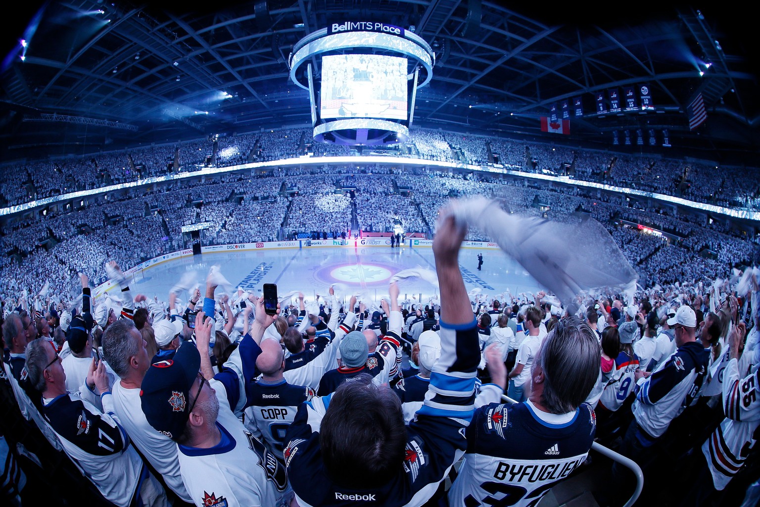 Winnipeg Jets fans cheer as the team hits the ice for Game 2 of an NHL hockey first-round playoff series against the Minnesota Wild on Friday, April 13, 2018, in Winnipeg, Manitoba. (John Woods/The Ca ...