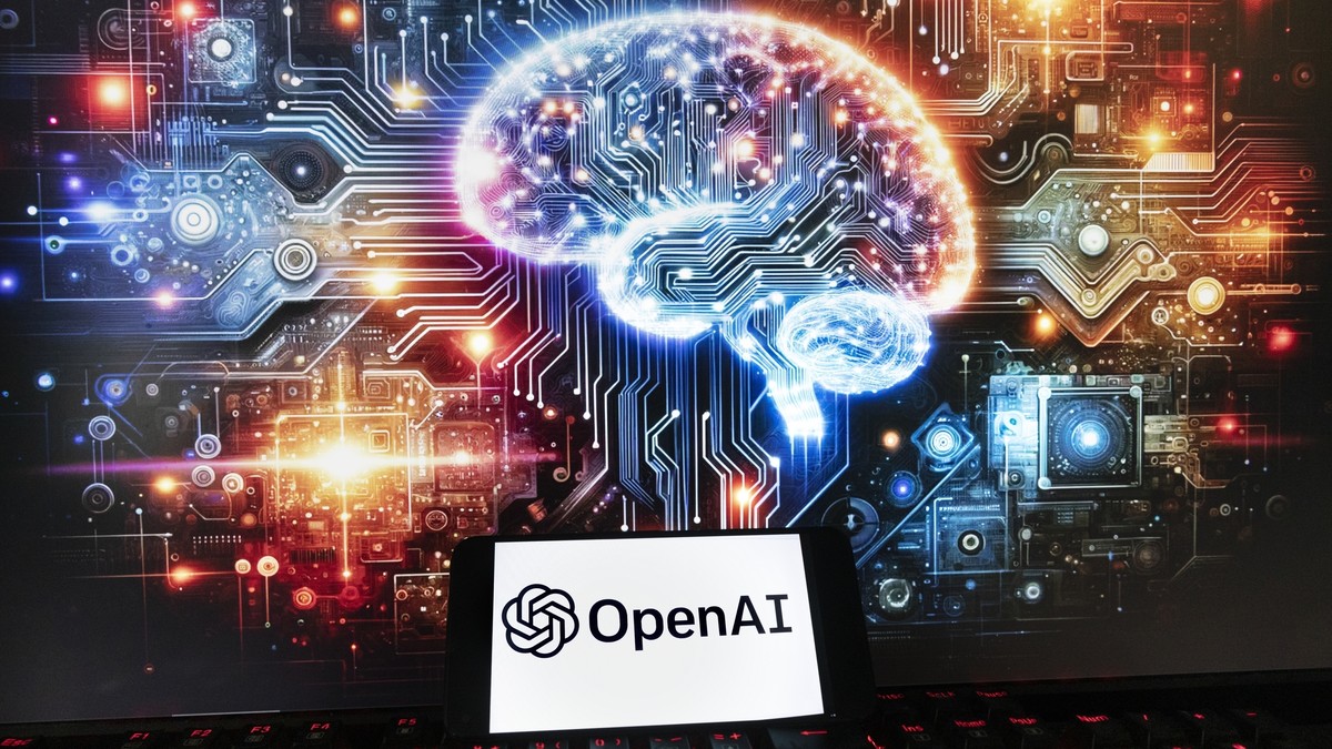 FILE - The OpenAI logo is seen displayed on a cell phone with an image on a computer monitor generated by ChatGPT's Dall-E text-to-image model, Friday, Dec. 8, 2023, in Boston. OpenAI says it ...