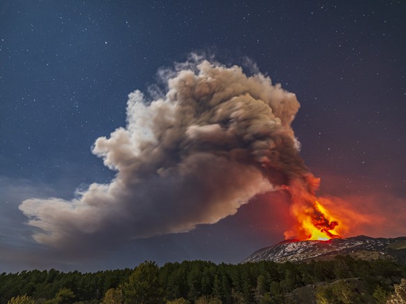 Smoke billows from the Mt. Etna volcano, as seen from Nicolosi, Sicily, southern Italy, Thursday, Feb. 10 , 2022. (AP Photo/Salvatore Allegra)