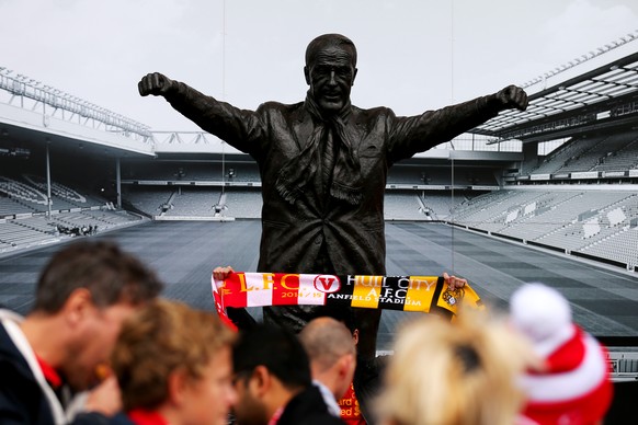 LIVERPOOL, ENGLAND - OCTOBER 25: Fans walk past the Bill Shankly statue before the Barclays Premier League match between Liverpool and Hull City at Anfield on October 25, 2014 in Liverpool, England. ( ...
