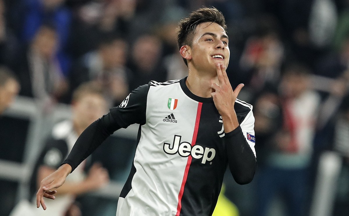 Juventus' Paulo Dybala celebrates after scoring the opening goal during the Champions League group D soccer match between Juventus and Atletico Madrid at the Allianz stadium in Turin, Italy, Tues ...