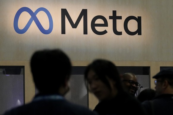 FILE - Attendees visit the Meta booth at the Game Developers Conference 2023, March 22, 2023, in San Francisco. Meta will face a hefty fine over advertising practices that violate user privacy, Norway ...