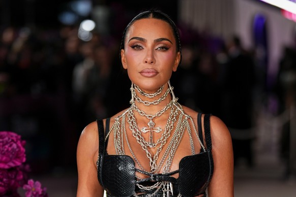 Kim Kardashian poses for photographers upon arrival at the premiere of the television series &quot;All&#039;s Fair&quot; on Wednesday, Oct. 22, 2025, in London. (Photo by Scott A Garfitt/Invision/AP)
 ...