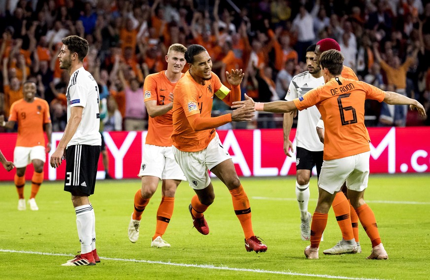 epa07091120 Virgil van Dijk (C) of the Dutch national team celebrates after he scored 1-0 during the UEFA Nations League, league A, group 1, soccer match between the Netherlands and Germany at Johan C ...