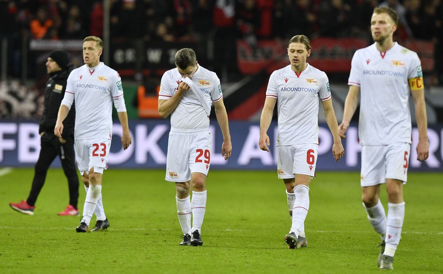 Union&#039;s players leave the pitch disappointed after losing the German soccer cup, DFB Pokal, quarter-final match between Bayer Leverkusen and Union Berlin in Leverkusen, Germany, Wednesday, March  ...