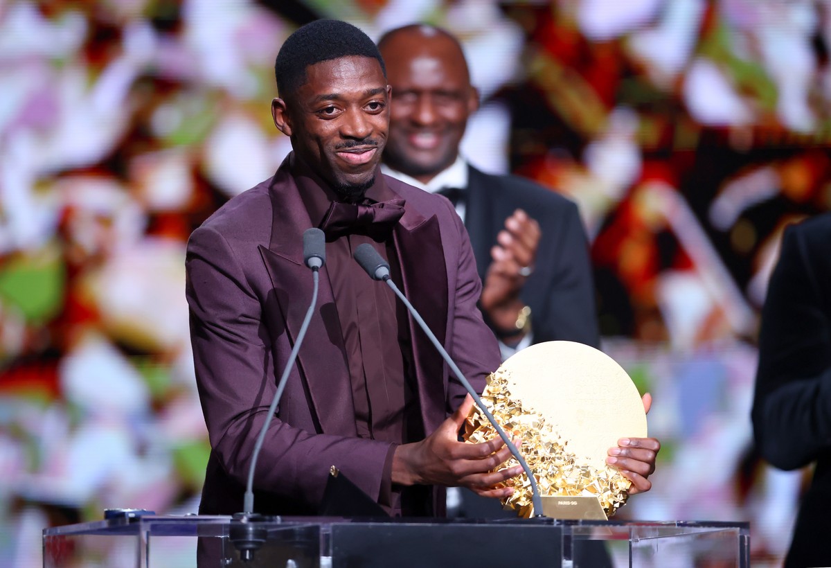 epa13333469 Paris Saint-Germain forward Ousmane Dembele collects the award on behalf of the team after PSG won the Men's Club of the Year award at the 2026 Ballon d'Or awards ceremony at the ...