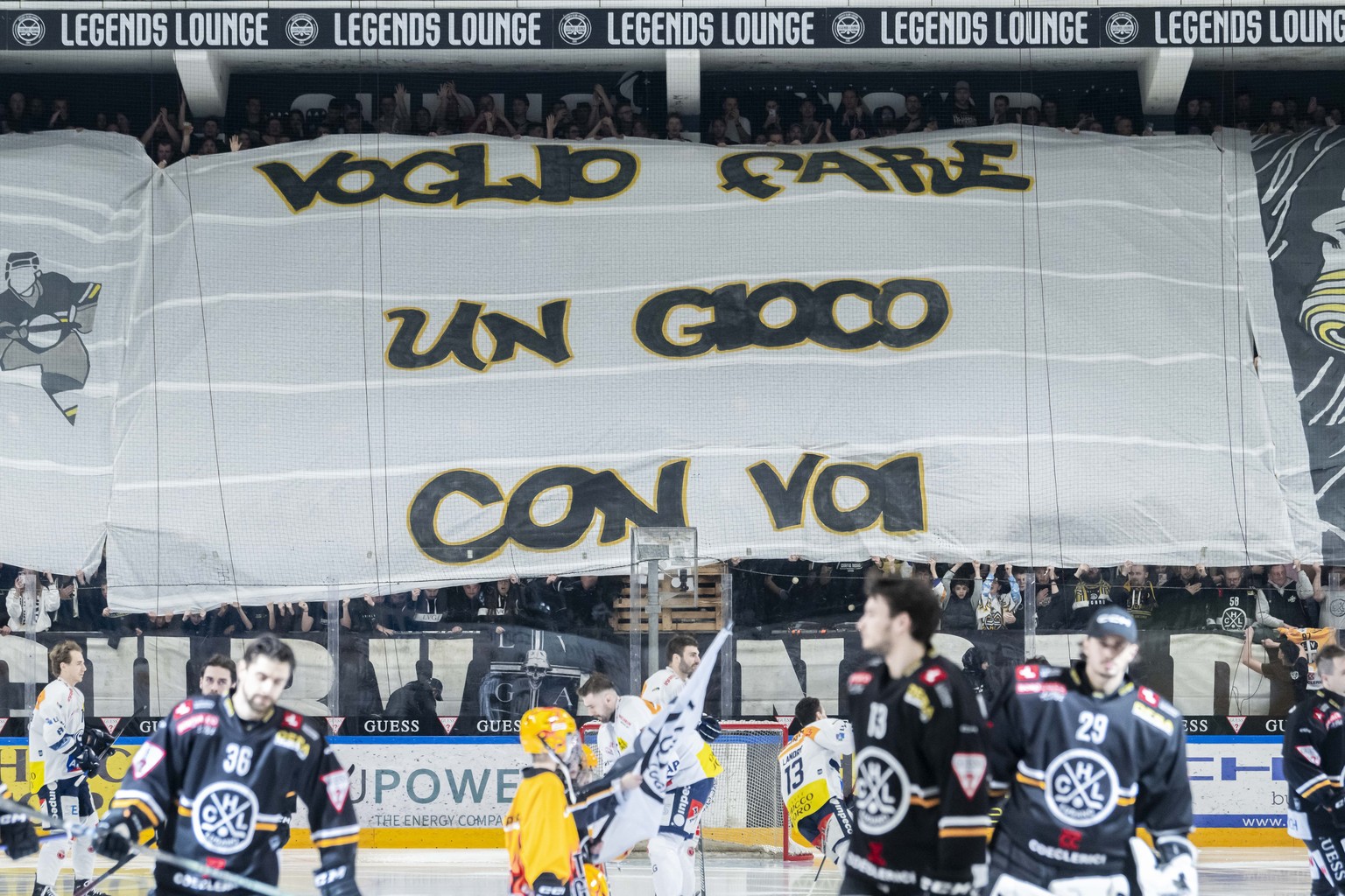Lugano&#039;s fan, Ambri&#039;s player Tim Heed and Lugano&#039;s player Mark Arcobello, during the Play-in game of National League A (NLA) Swiss Championship 2023/24 between, HC Lugano against HC Amb ...