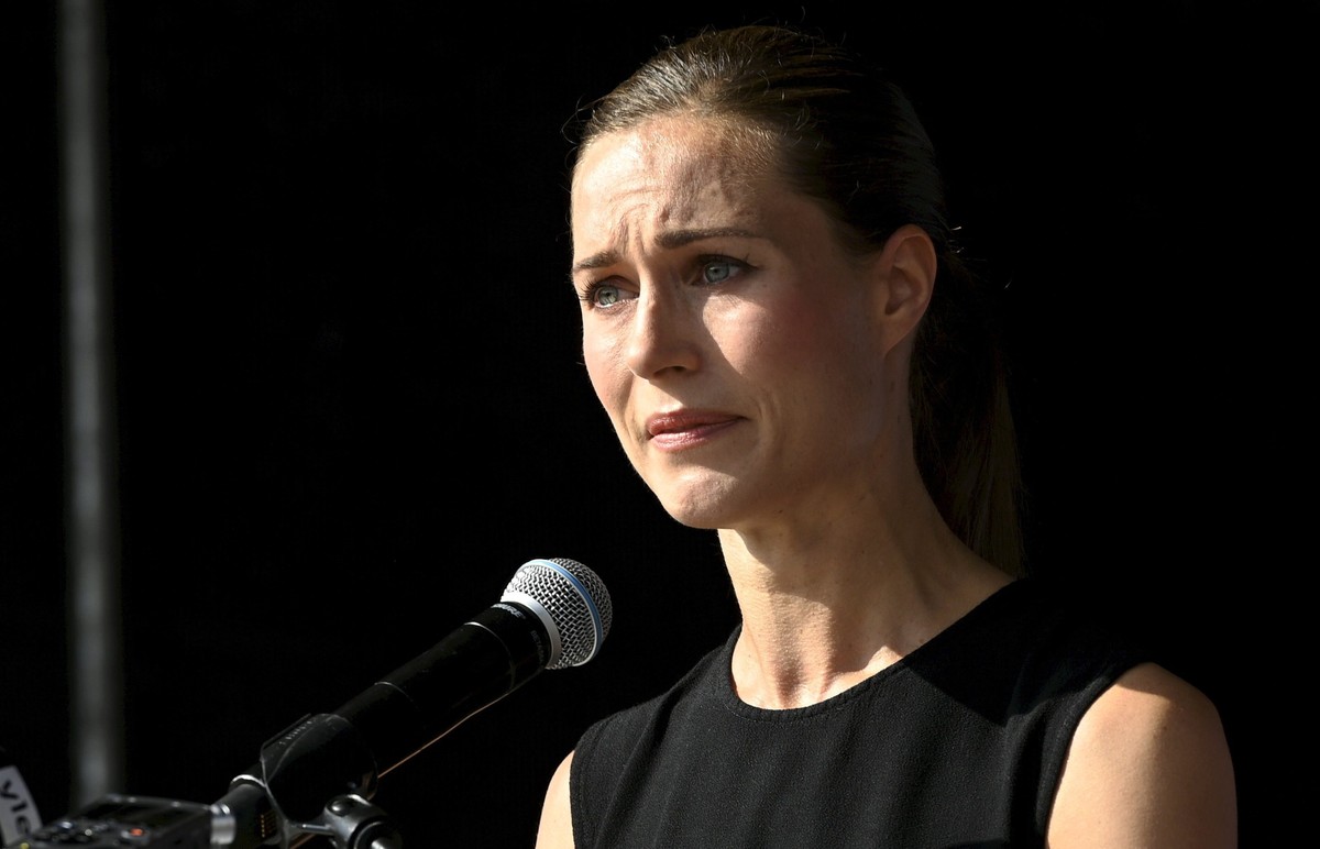 Finnish Prime Minister Sanna Marin delivers a speech during a meeting of the Social Democratic party in Lahti, Finland, Wednesday Aug. 24, 2022. Marin apologized Wednesday after the publication of a p ...