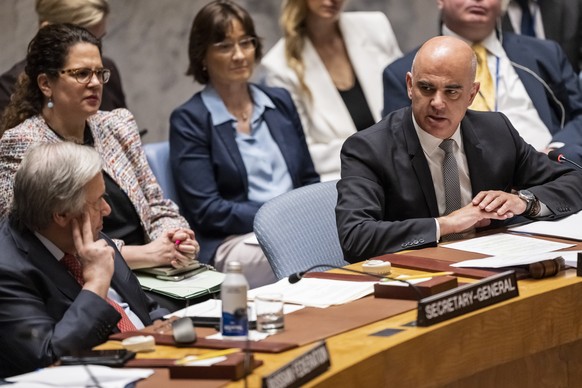 Alain Berset, Swiss Federal President, right, chairs a Security Council Open Debate on the security and dignity of civilians in conflict next to Antonio Guterres, UN Secretary General, left, on Tuesda ...