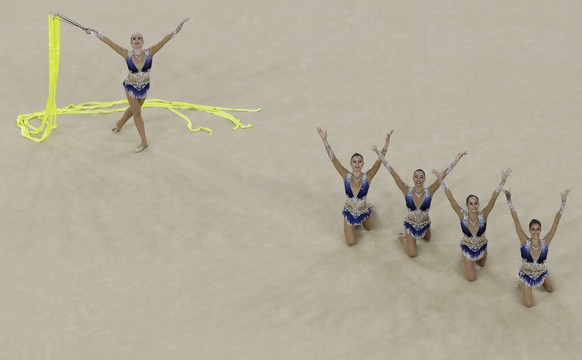 Team Italy performs during the rhythmic gymnastics group all-around final at the 2016 Summer Olympics at the Olympic stadium in Rio de Janeiro, Brazil, Sunday, Aug. 21, 2016. (AP Photo/Dmitri Lovetsky ...