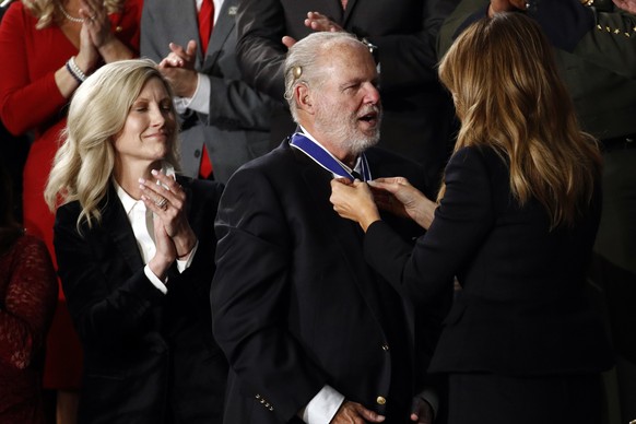 First Lady Melania Trump presents the Presidential Medal of Freedom to Rush Limbaugh as his wife Kathryn watches during the State of the Union address to a joint session of Congress on Capitol Hill in ...