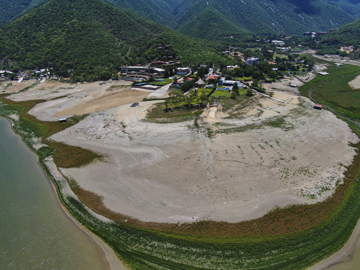 A view of The Boca reservoir that supplies water to the northern city of Monterrey is almost dry as the northern part of Mexico is affected by an intense drought, in Santiago, Mexico, Saturday, July 9 ...